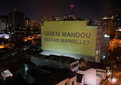 A projection on a building honouring slain councilwoman Marielle Franco reads