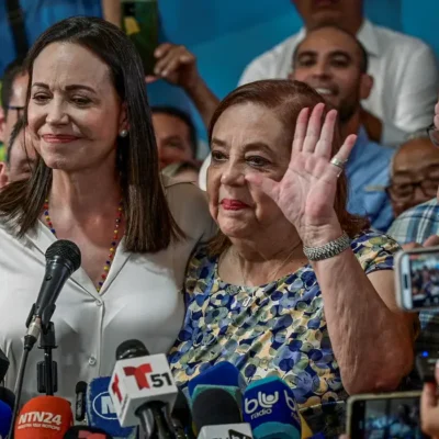 Venezuelan opposition leader Maria Corina Machado poses with Corina Yoris Villasana, whom she nominated to replace her as a presidential candidate, during a press conference in Caracas, Venezuela, March 22, 2024. REUTERS/Gaby Oraa