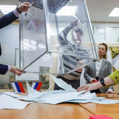 Members of an electoral commission empty a ballot box, after polling stations closed on the final day of the presidential election in Saint Petersburg, Russia, March 17, 2024. REUTERS/Anton Vaganov
