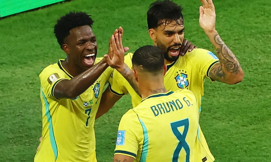 Soccer Football - FIFA World Cup 2026 - Group C - Scotland v Brazil - Miami Stadium, Miami Gardens, Florida, U.S. - June 24, 2026 Brazil's Vinicius Junior celebrates scoring their second goal with Lucas Paqueta and Bruno Guimaraes REUTERS/Marco Bello