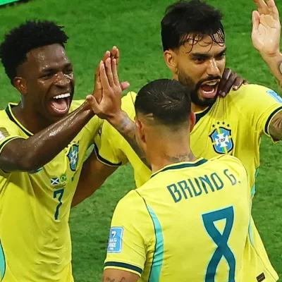 Soccer Football - FIFA World Cup 2026 - Group C - Scotland v Brazil - Miami Stadium, Miami Gardens, Florida, U.S. - June 24, 2026 Brazil's Vinicius Junior celebrates scoring their second goal with Lucas Paqueta and Bruno Guimaraes REUTERS/Marco Bello