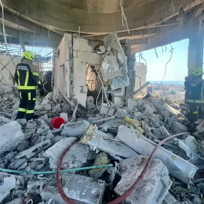 Bahrain civil defence and rescue personnel work in a residential building, which according to the Bahraini Interior Ministry, was hit by an Iranian drone, in Muharraq, Bahrain, June 28, 2026. Bahrain Police Media/Handout via REUTERS