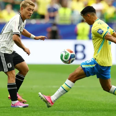 Soccer Football - FIFA World Cup 2026 - Round of 32 - Brazil v Japan - Houston Stadium, Houston, Texas, U.S. - June 29, 2026 Japan's Ritsu Doan in action with Brazil's Douglas Santos REUTERS/Phil Noble