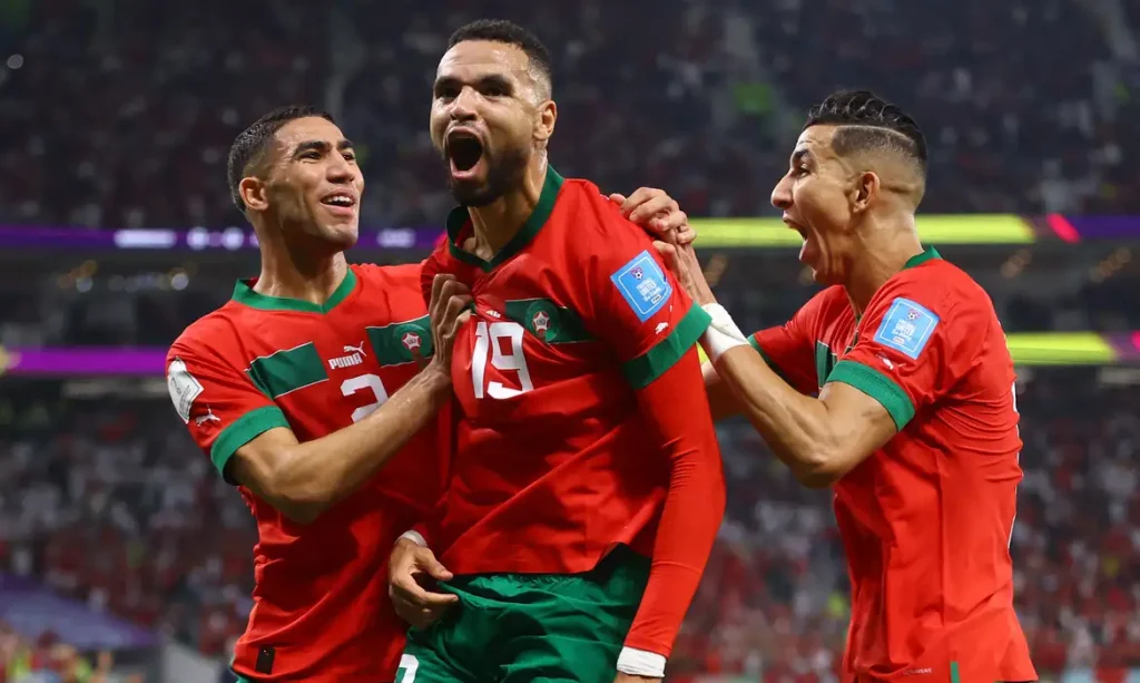 Soccer Football - FIFA World Cup Qatar 2022 - Quarter Final - Morocco v Portugal - Al Thumama Stadium, Doha, Qatar - December 10, 2022 Morocco's Youssef En-Nesyri celebrates scoring their first goal with teammates REUTERS/Carl Recine