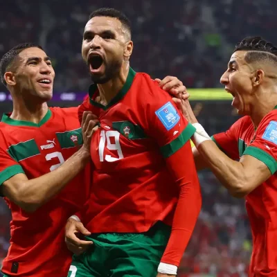Soccer Football - FIFA World Cup Qatar 2022 - Quarter Final - Morocco v Portugal - Al Thumama Stadium, Doha, Qatar - December 10, 2022 Morocco's Youssef En-Nesyri celebrates scoring their first goal with teammates REUTERS/Carl Recine