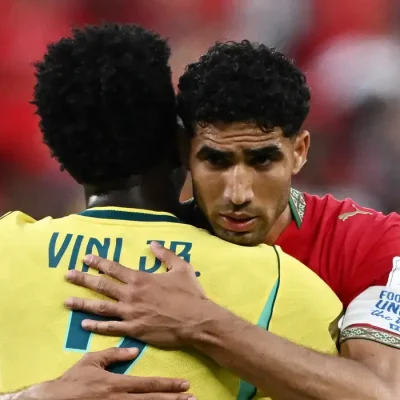 Soccer Football - FIFA World Cup 2026 - Group C - Brazil v Morocco - New York/New Jersey Stadium, East Rutherford, New Jersey, U.S. - June 13, 2026 Morocco's Achraf Hakimi embraces Brazil's Vinicius Junior after the match REUTERS/Dylan Martinez