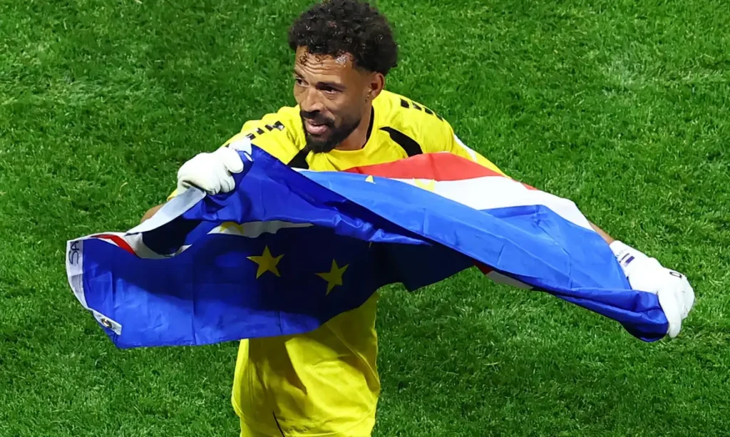 Soccer Football - FIFA World Cup 2026 - Group H - Spain v Cape Verde - Atlanta Stadium, Atlanta, Georgia, U.S. - June 15, 2026 Cape Verde's Vozinha celebrates with their national flag after the match REUTERS/Bernadett Szabo