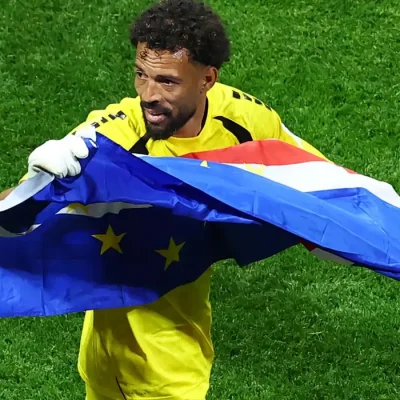 Soccer Football - FIFA World Cup 2026 - Group H - Spain v Cape Verde - Atlanta Stadium, Atlanta, Georgia, U.S. - June 15, 2026 Cape Verde's Vozinha celebrates with their national flag after the match REUTERS/Bernadett Szabo