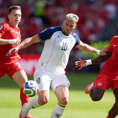 Soccer Football - FIFA World Cup 2026 - Group B - Canada v Bosnia and Herzegovina - Toronto Stadium, Toronto, Canada - June 12, 2026 Bosnia and Herzegovina's Ermedin Demirovic in action with Canada's Richie Laryea and Alistair Johnston IMAGN IMAGES via Reuters/John Sokolowski