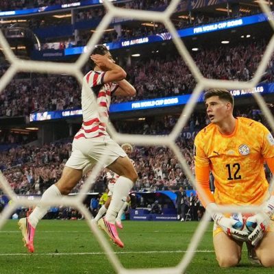 Soccer Football - FIFA World Cup 2026 - Group D - United States v Paraguay - Los Angeles Stadium, Inglewood, California, U.S. - June 12, 2026 Giovanni Reyna of the U.S. celebrates scoring their fourth goal as Paraguay's Orlando Gill looks dejected IMAGN IMAGES via Reuters/Kirby Lee