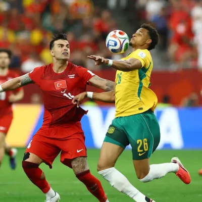 Soccer Football - FIFA World Cup 2026 - Group D - Australia v Turkey - BC Place, Vancouver, Canada - June 13, 2026 Australia's Tete Yengi in action with Turkey's Abdulkerim Bardakci REUTERS/Albert Gea