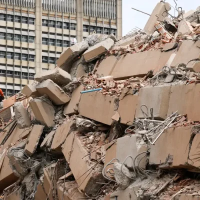 A rescuer works at the site of a collapsed building after earthquakes hit the country, in Caracas, Venezuela, June 25, 2026. REUTERS/Leonardo Fernandez Viloria