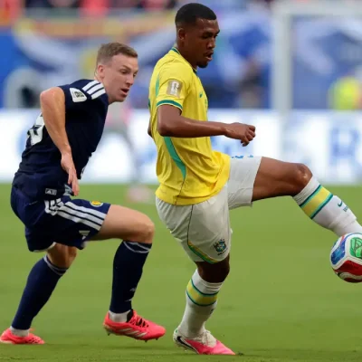 Soccer Football - FIFA World Cup 2026 - Group C - Scotland v Brazil - Miami Stadium, Miami Gardens, Florida, U.S. - June 24, 2026 Brazil's Rayan in action with Scotland's Lewis Ferguson IMAGN IMAGES via Reuters/Sam Navarro