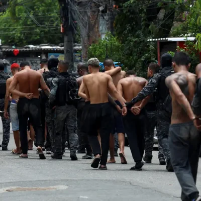 Members of the military police special unit detain suspected drug dealers during a police operation against drug trafficking at the favela do Penha, in Rio de Janeiro, Brazil October 28, 2025. REUTERS/Aline Massuca