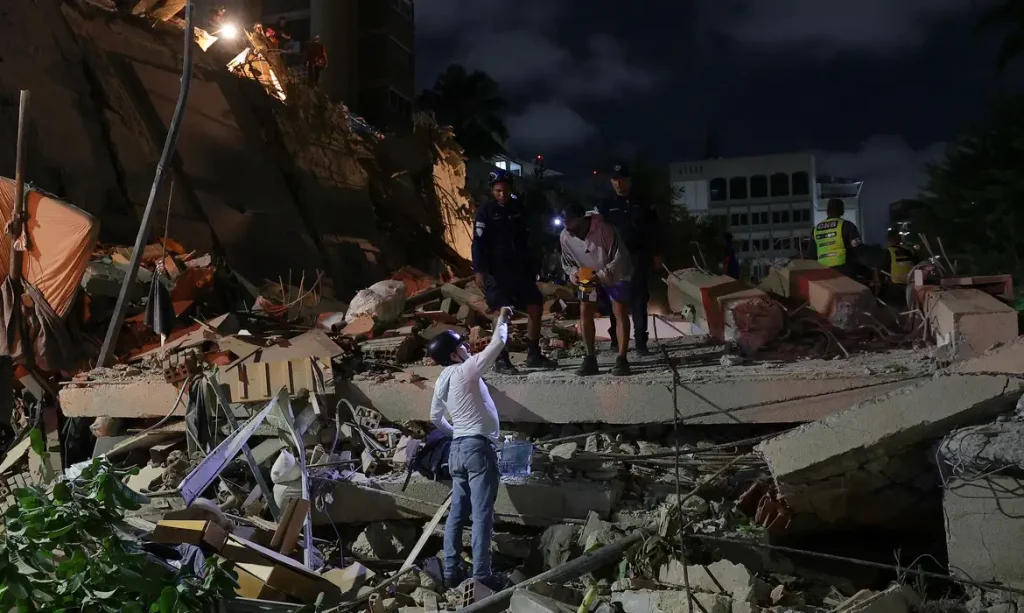 Emergency services work at the site of a collapsed building after an earthquake, in Caracas, Venezuela, June 24, 2026. REUTERS/Gaby Oraa
