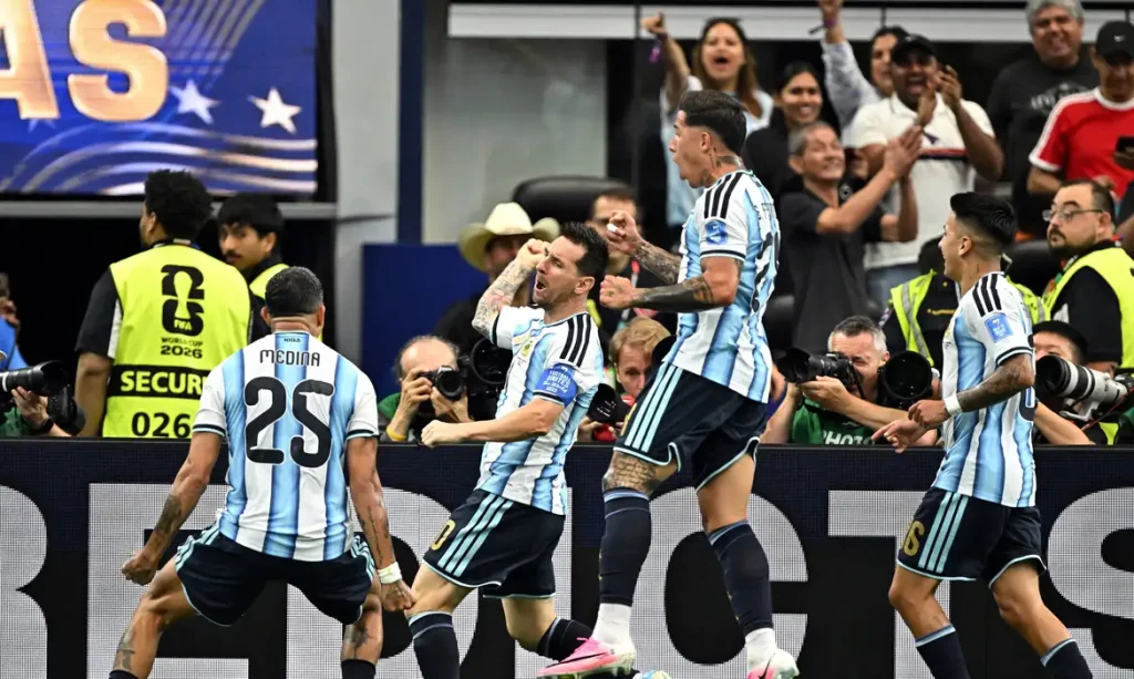 Soccer Football - FIFA World Cup 2026 - Group J - Argentina v Austria - Dallas Stadium, Arlington, Texas, U.S. - June 22, 2026
Argentina's Lionel Messi celebrates scoring their first goal with Enzo Fernandez, Facundo Medina and Thiago Almada IMAGN IMAGES via Reuters/Maria Lysaker TPX IMAGES OF THE DAY