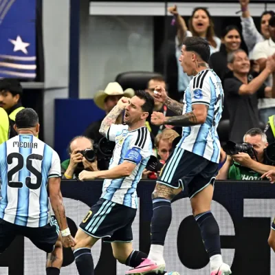 Soccer Football - FIFA World Cup 2026 - Group J - Argentina v Austria - Dallas Stadium, Arlington, Texas, U.S. - June 22, 2026
Argentina's Lionel Messi celebrates scoring their first goal with Enzo Fernandez, Facundo Medina and Thiago Almada IMAGN IMAGES via Reuters/Maria Lysaker TPX IMAGES OF THE DAY