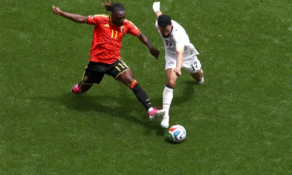 Soccer Football - FIFA World Cup 2026 - Group G - Belgium v Egypt - Seattle Stadium, Seattle, Washington, U.S. - June 15, 2026 Belgium's Jeremy Doku in action with Egypt's Mohanad Lashin REUTERS/Lee Smith