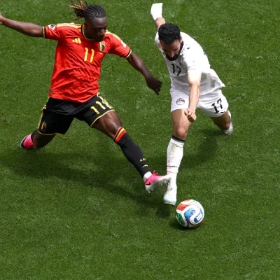Soccer Football - FIFA World Cup 2026 - Group G - Belgium v Egypt - Seattle Stadium, Seattle, Washington, U.S. - June 15, 2026 Belgium's Jeremy Doku in action with Egypt's Mohanad Lashin REUTERS/Lee Smith