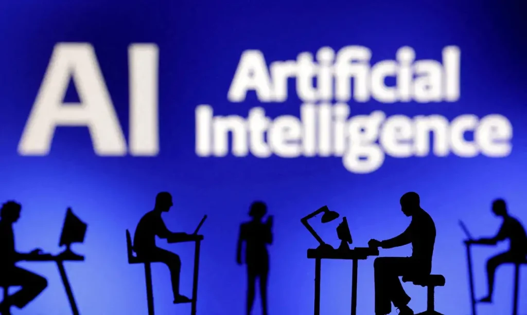 Bonecos com computadores e smartphones são vistos em frente às palavras “Inteligência Artificial IA” nesta ilustração tirada em 19 de fevereiro de 2024. REUTERS/Dado Ruvic/Ilustração/Foto de arquivo