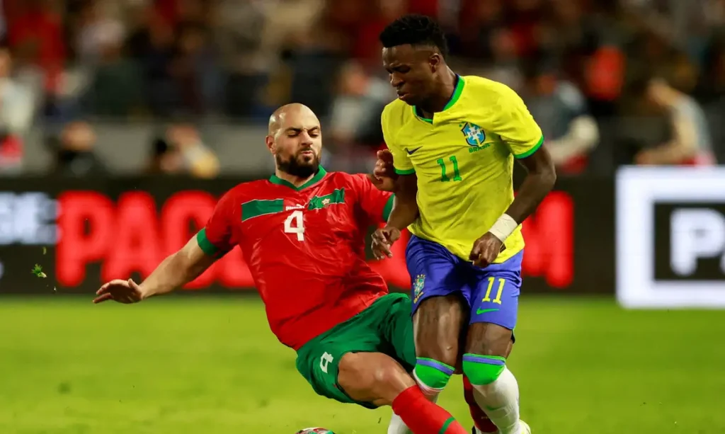FILE PHOTO: Soccer Football - International Friendly - Morocco v Brazil - Grand Stade de Tanger, Tangier, Morocco - March 25, 2023 Morocco's Sofyan Amrabat fouls Brazil's Vinicius Junior REUTERS/Juan Medina/File Photo