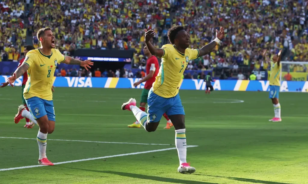 Soccer Football - FIFA World Cup 2026 - Group C - Brazil v Morocco - New York/New Jersey Stadium, East Rutherford, New Jersey, U.S. - June 13, 2026 Brazil's Vinicius Junior celebrates scoring their first goal with Bruno Guimaraes IMAGN IMAGES via Reuters/Vincent Carchietta