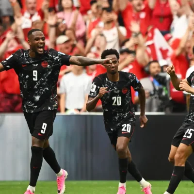 Soccer Football - FIFA World Cup 2026 - Group B - Canada v Qatar - BC Place, Vancouver, Canada - June 18, 2026 Canada's Nathan Saliba celebrates scoring their fourth goal with Cyle Larin and Ali Ahmed IMAGN IMAGES via Reuters/Anne-Marie Sorvin