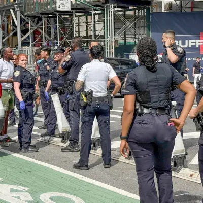 New York Police Department officers gather after alleged gunfire was heard in Times Square, in New York City, U.S., June 18, 2026.  Picture taken with a phone. REUTERS/Andrew Hofstetter