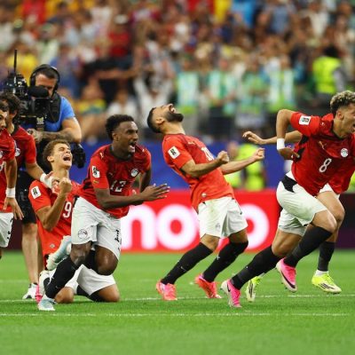 Soccer Football - FIFA World Cup 2026 - Round of 32 - Australia v Egypt - Dallas Stadium, Arlington, Texas, U.S. - July 3, 2026 Egypt players celebrate after Hossam Abdelmaguid scores the penalty past Australia's Mathew Ryan to win the shoot-out as Egypt qualify for the Round of 16 stage of the World Cup REUTERS/Hannah Mckay