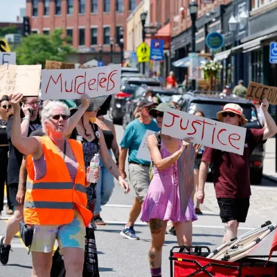 People take part in a protest after a shooting involving U.S. Immigration and Customs Enforcement (ICE) in Biddeford, Maine, U.S. July 13, 2026. REUTERS/CJ Gunther