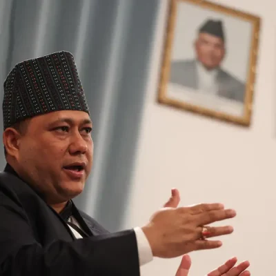 Nepal's Foreign Minister Shisir Khanal speaks in front of portraits of Nepal's President Ramchandra Paudel and Prime Minister Balendra Shah, during an interview with Reuters at the Embassy of Nepal in Beijing, China, June 16, 2026. REUTERS/Tingshu Wang