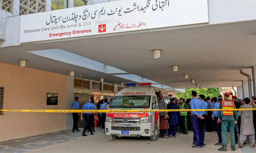 Police officers move past an ambulance outside an intensive care unit after a fire broke out at the Pakistan Institute of Medical Sciences (PIMS) hospital in Islamabad, Pakistan, August 26, 2026. REUTERS/Akhtar Soomro TPX IMAGES OF THE DAY
