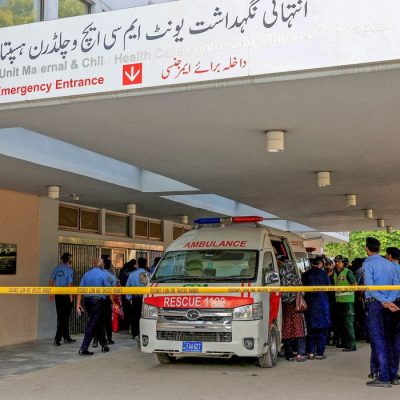 Police officers move past an ambulance outside an intensive care unit after a fire broke out at the Pakistan Institute of Medical Sciences (PIMS) hospital in Islamabad, Pakistan, August 26, 2026. REUTERS/Akhtar Soomro     TPX IMAGES OF THE DAY