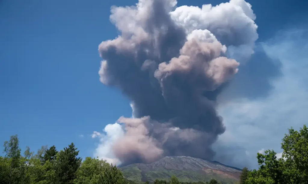 Plumes of volcanic ash and smoke rise from Mount Etna, as seen from Milo, Italy, June 2, 2025. REUTERS/Giuseppe di Stefano