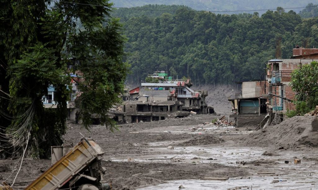 Mud covers houses and a road following a flash flood at Trishuli in Nuwakot district, Nepal, August 26, 2026. REUTERS/Navesh Chitrakar