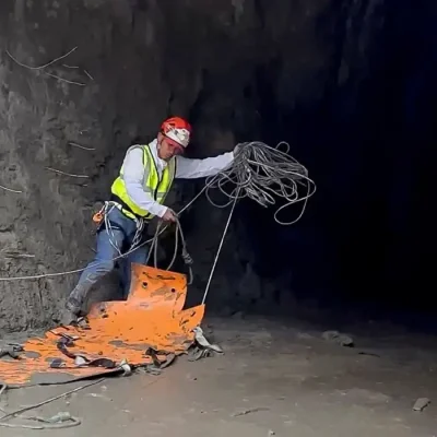 A rescuer works at the entrance of a tunnel at Chilime Hydropower Plant as rescue operations continue for people trapped inside following deadly flash floods and a mudslide, in Rasuwa, Nepal, August 29, 2026, in this screengrab obtained from a social media video. Ashish Gurung/via REUTERS  THIS IMAGE HAS BEEN SUPPLIED BY A THIRD PARTY. MANDATORY CREDIT. NO RESALES. NO ARCHIVES. THIS PICTURE WAS CROPPED BY REUTERS TO ENHANCE QUALITY. AN UNCROPPED VERSION HAS BEEN PROVIDED  VERIFICATION: - Reuters was able to match the building layout and mountain terrain with topography imagery of the area.  - Nepal National Mountain Guide Association have said they are conducting rescue operations at the tunnel.