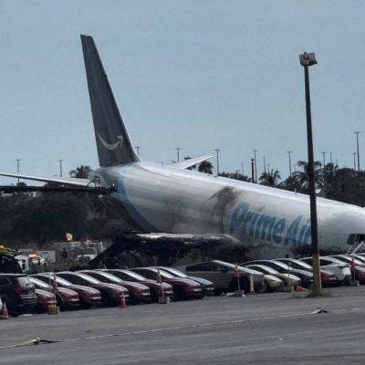 A view of the Amazon Prime Air cargo plane that airport officials said overran a runway at Miami, Florida, U.S., September 6, 2026, in this screengrab from a social media video. Rohan Ellis/via REUTERS  THIS IMAGE HAS BEEN SUPPLIED BY A THIRD PARTY. MANDATORY CREDIT. NO RESALES. NO ARCHIVES. THIS PICTURE WAS PROCESSED BY REUTERS TO ENHANCE QUALITY. AN UNPROCESSED VERSION HAS BEEN PROVIDED SEPARATELY.  VERIFICATION: - Date and location verified by metadata on original file - Fence, light poles and airfield layout matched archive imagery